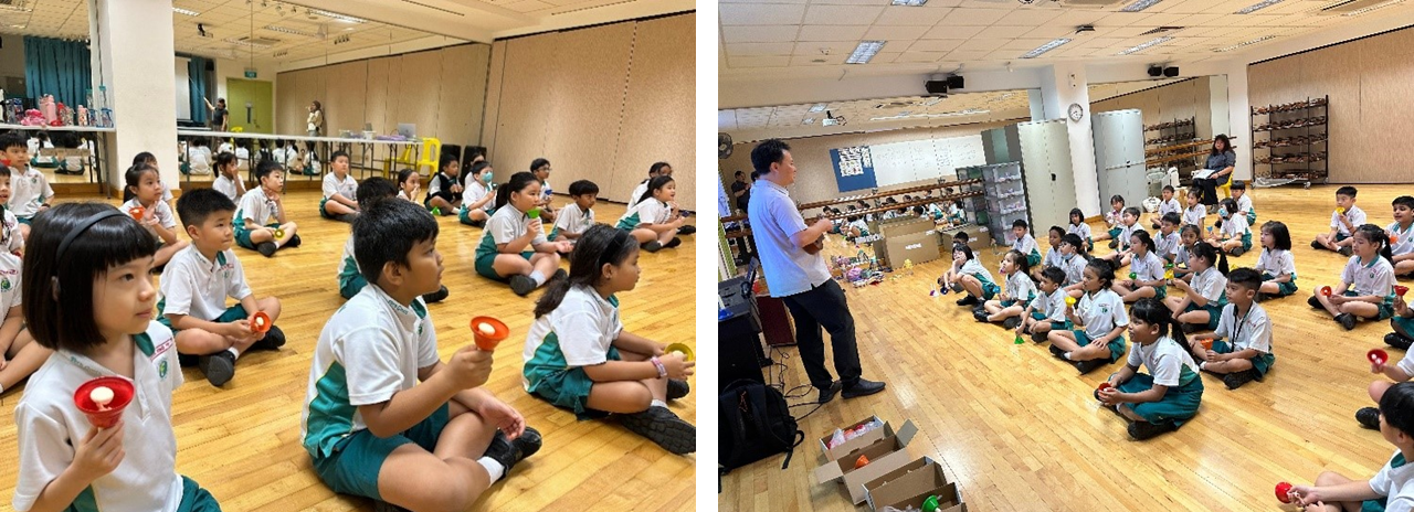 Young students in uniforms sit on a wooden floor holding colorful toys while an adult instructor stands before them.