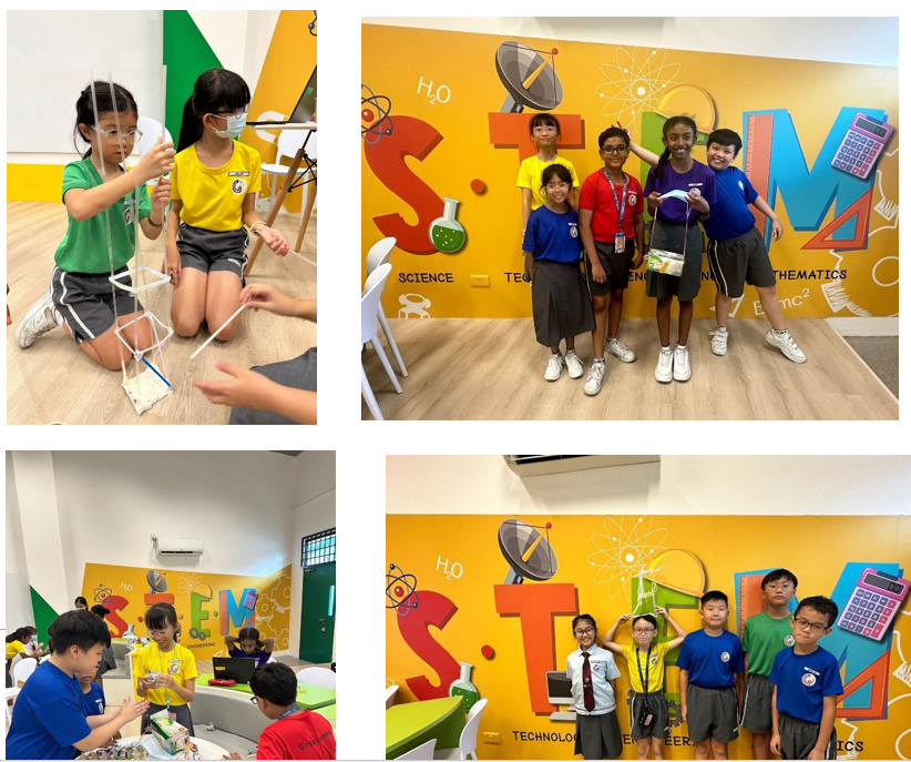 Children in a colorful STEM classroom building structures and posing in front of a bright STEM-themed wall.