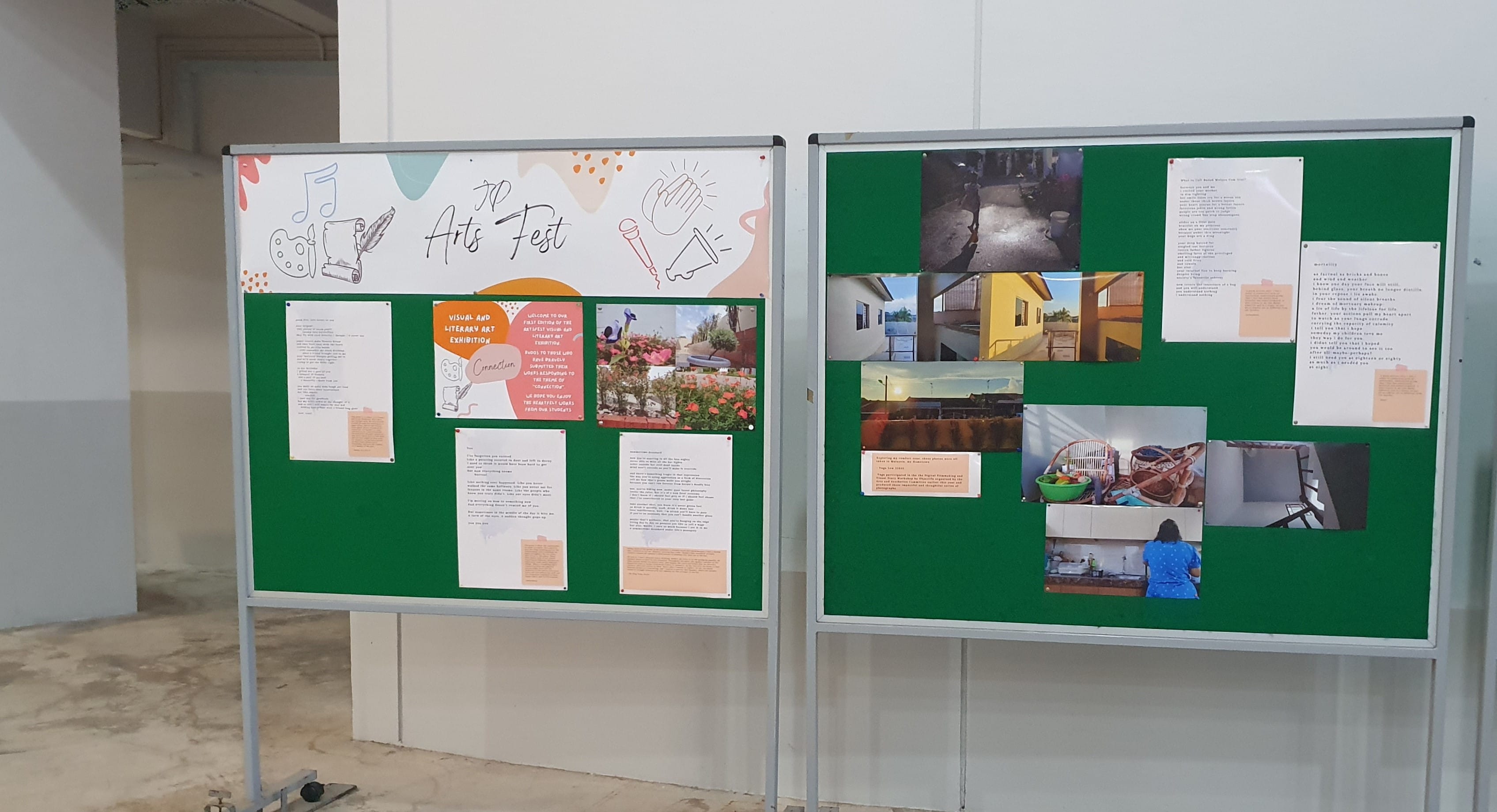 Two green bulletin boards displaying a student Arts Fest visual and literary art exhibition with photos and written pieces.