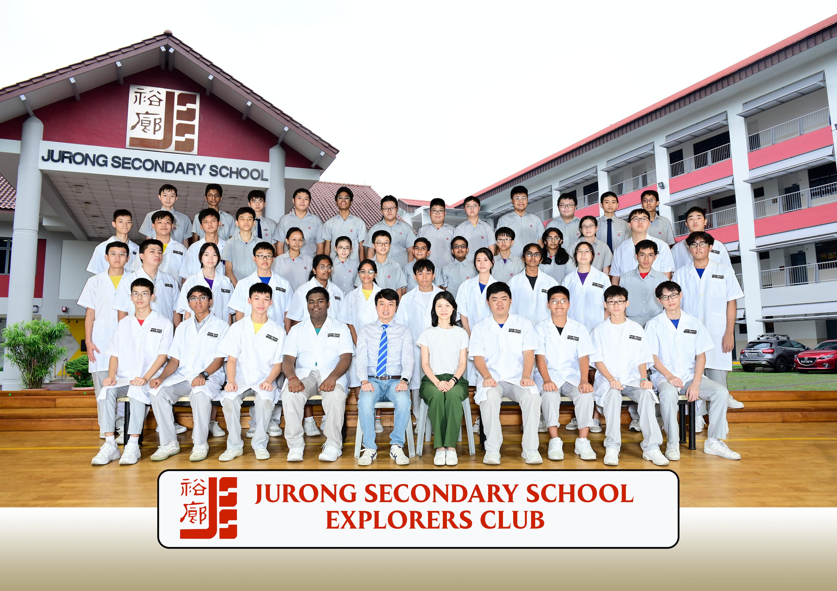 Group photo of Jurong Secondary School Explorers Club members and teachers posing in front of the school building.