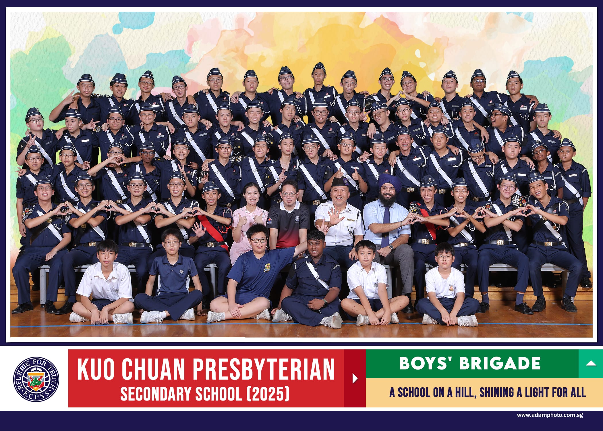 Group photo of Kuo Chuan Presbyterian Secondary School 2025 Boys' Brigade members in navy uniforms with teachers.