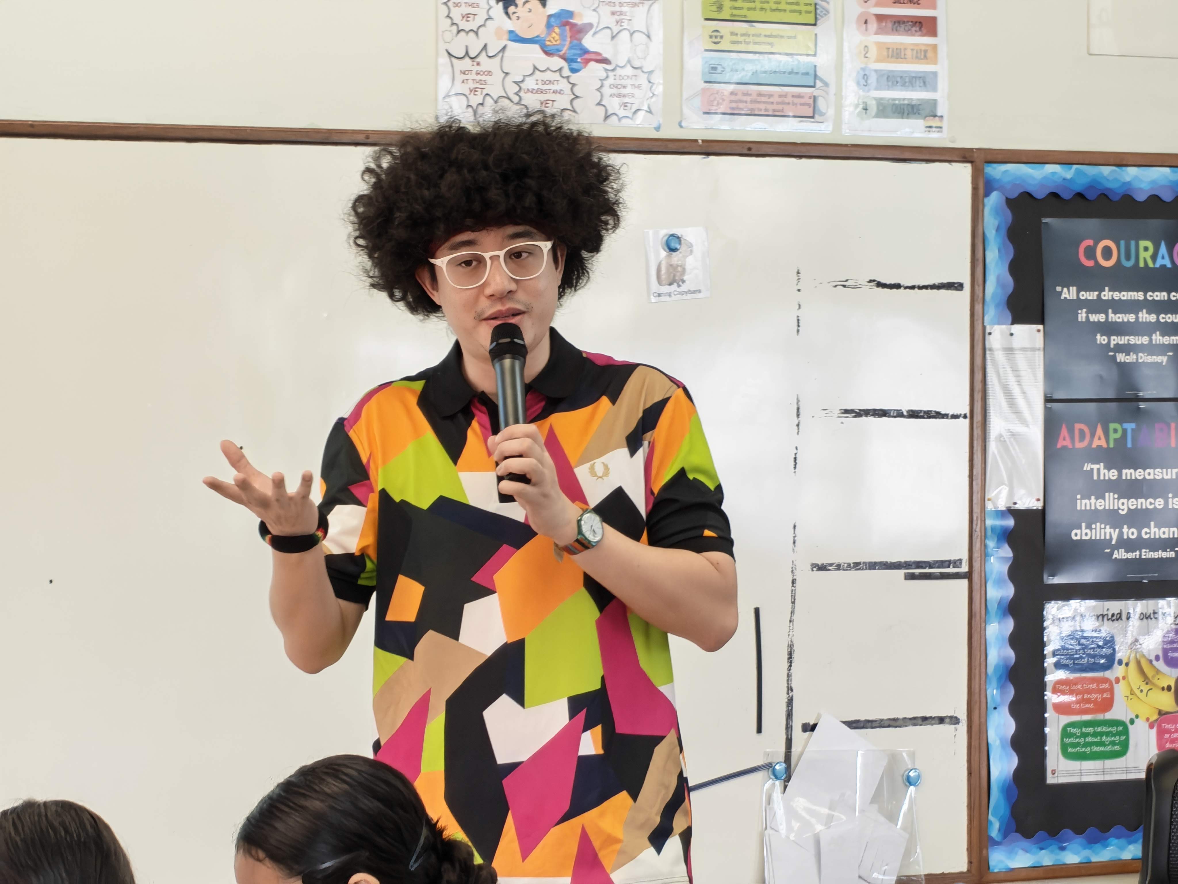 A Content Creator shares his career journey and experiences with Primary 6 students during an interactive classroom session.