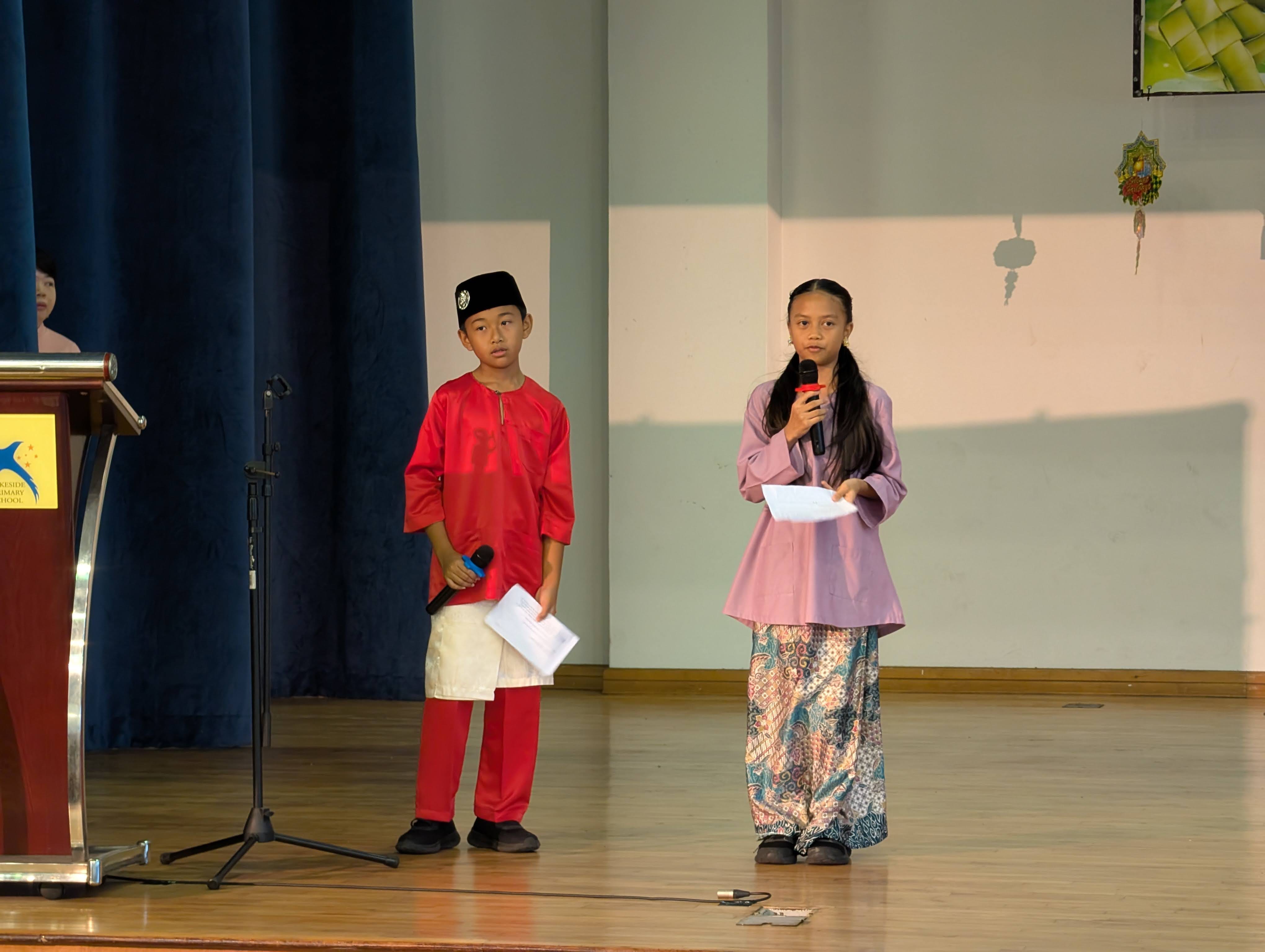 A photo of our emcees on stage
