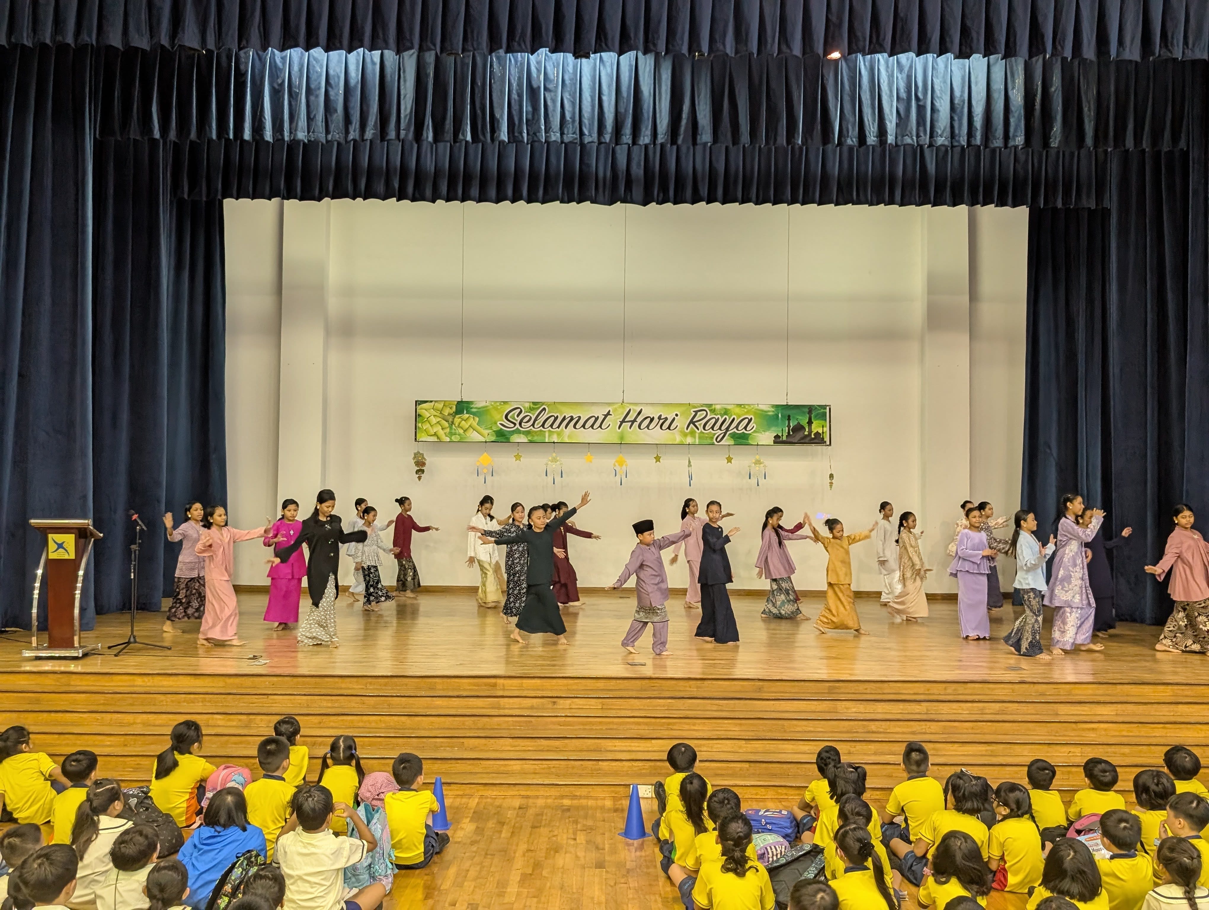 Dancers dancing to a Hari Raya medley on stage