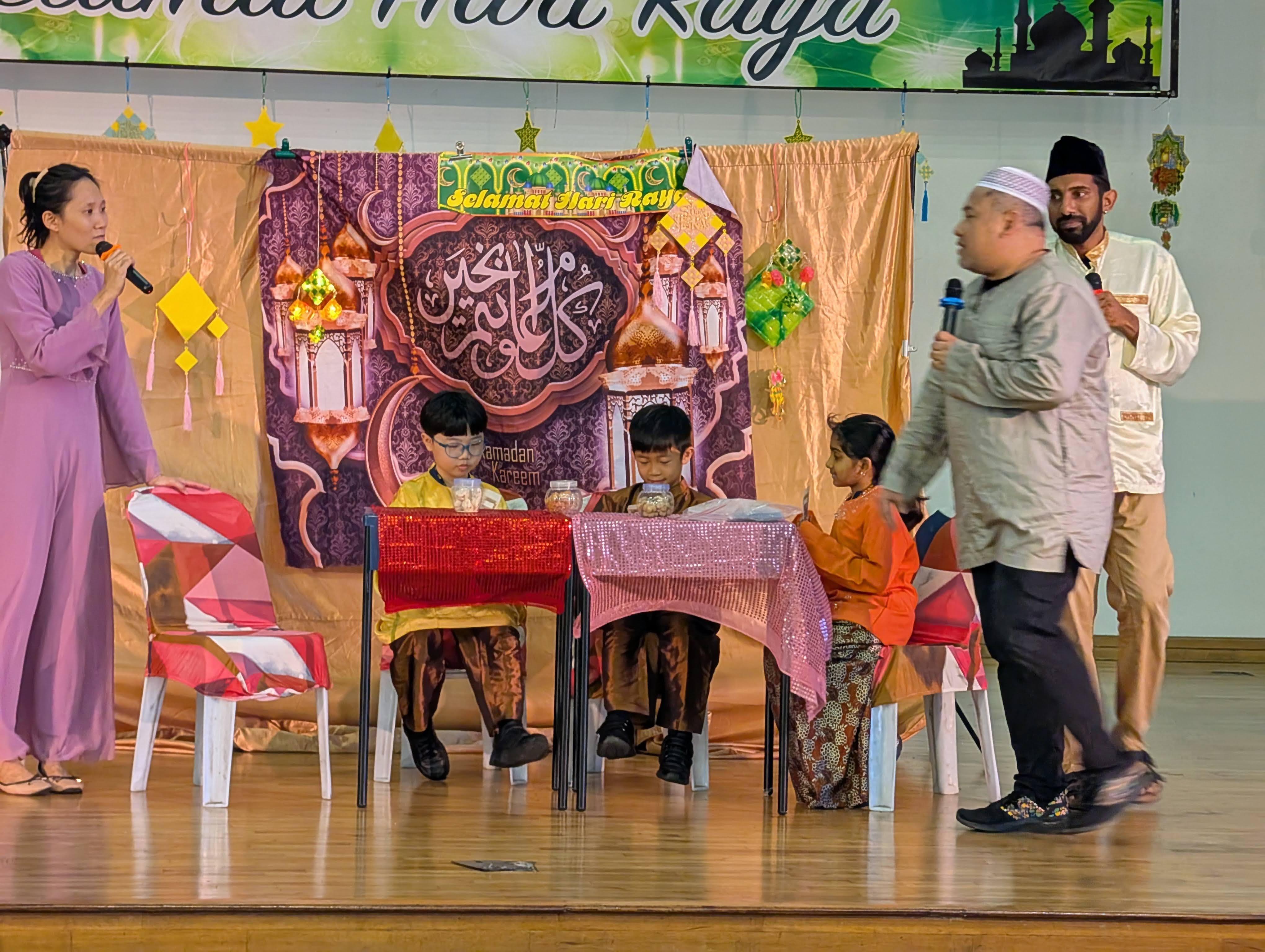 Students in costumes as part of the skit on stage