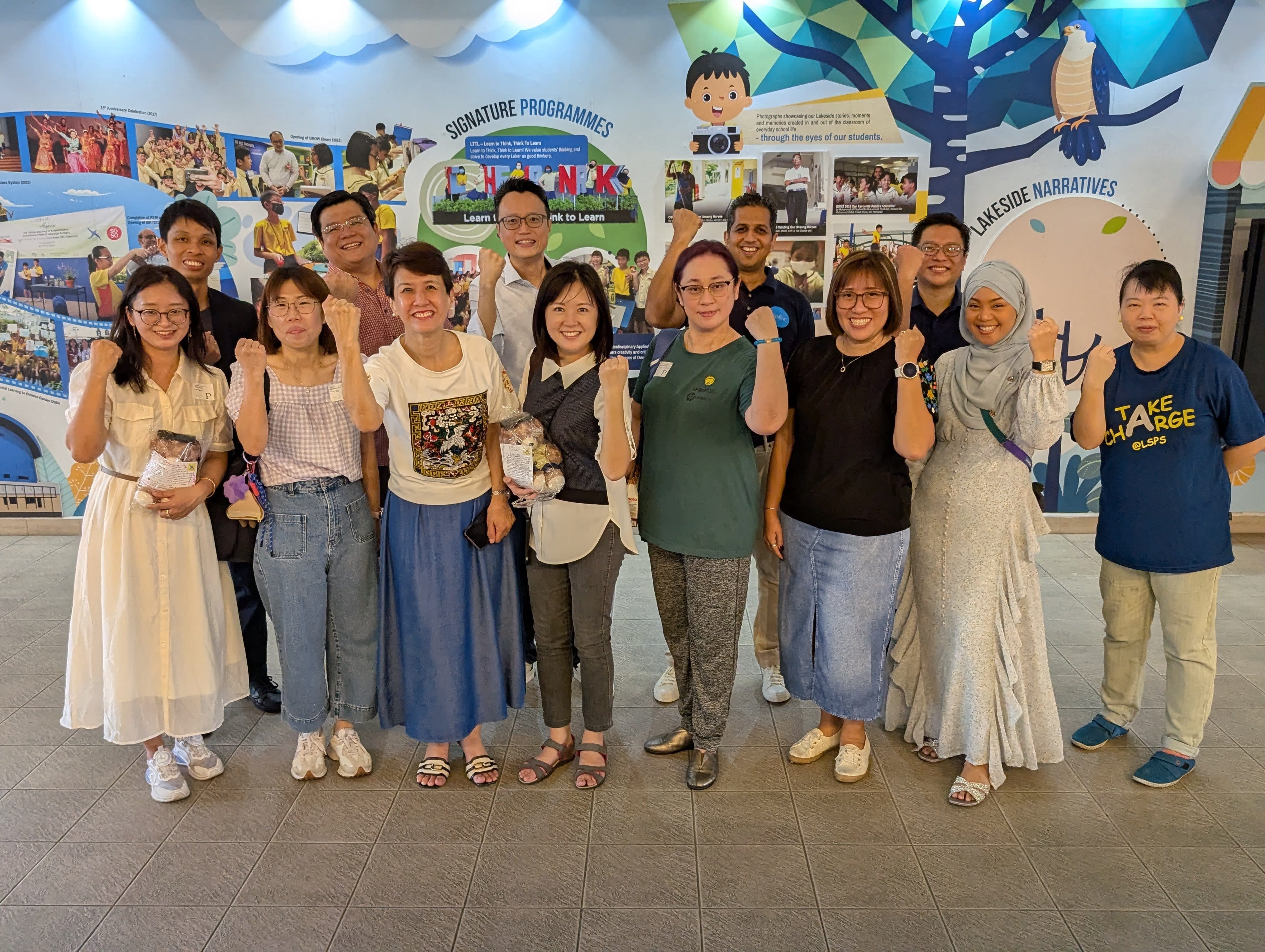 A group photo of staff and parent speakers after the event