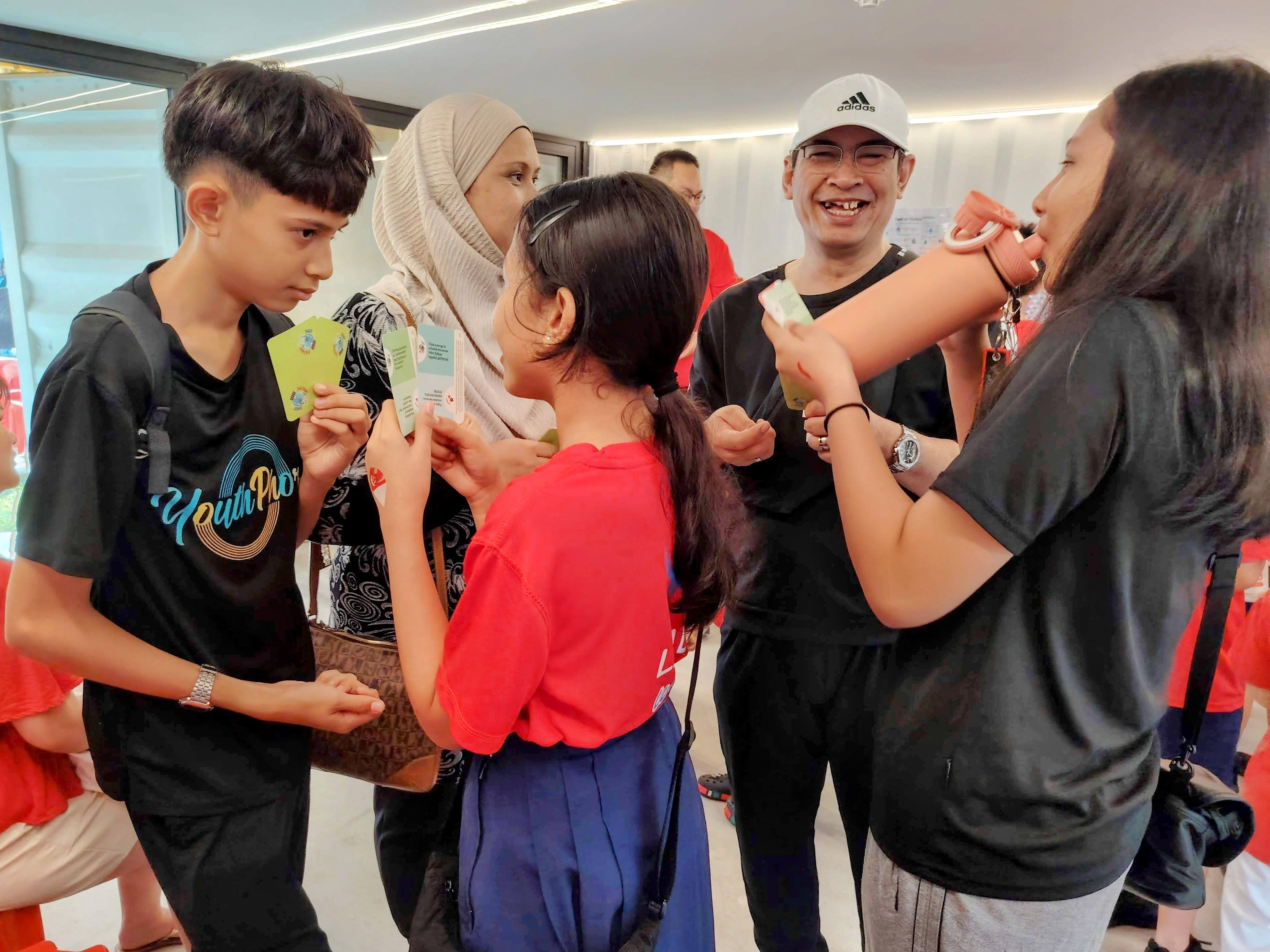 Group of people laughing and having fun, what SG60 is all about!