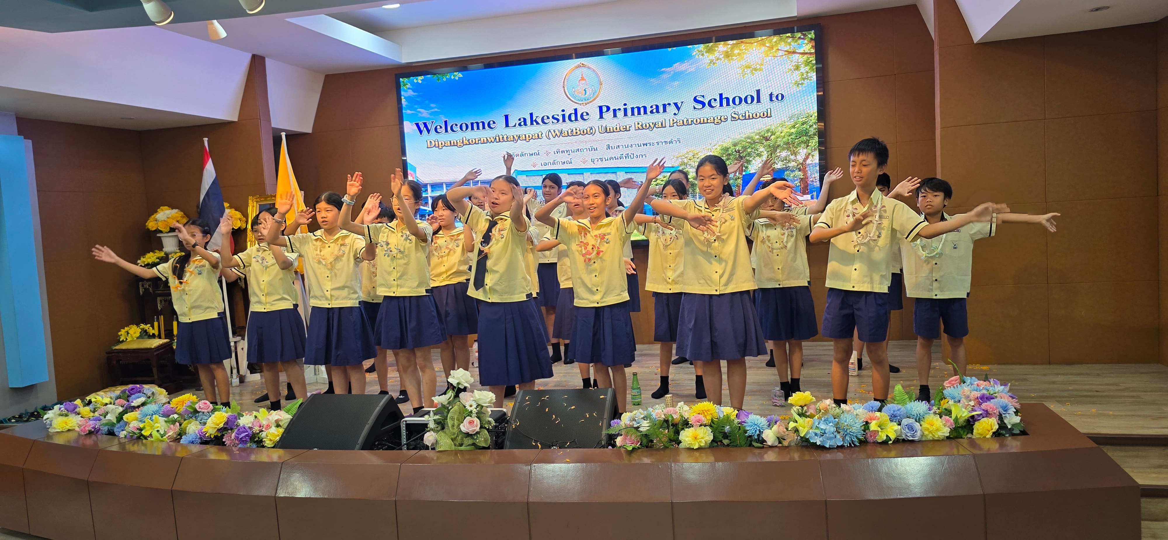 Lakeside Primary students on stage putting up a performance for the audience in Wat Bot and Anubasamsen School