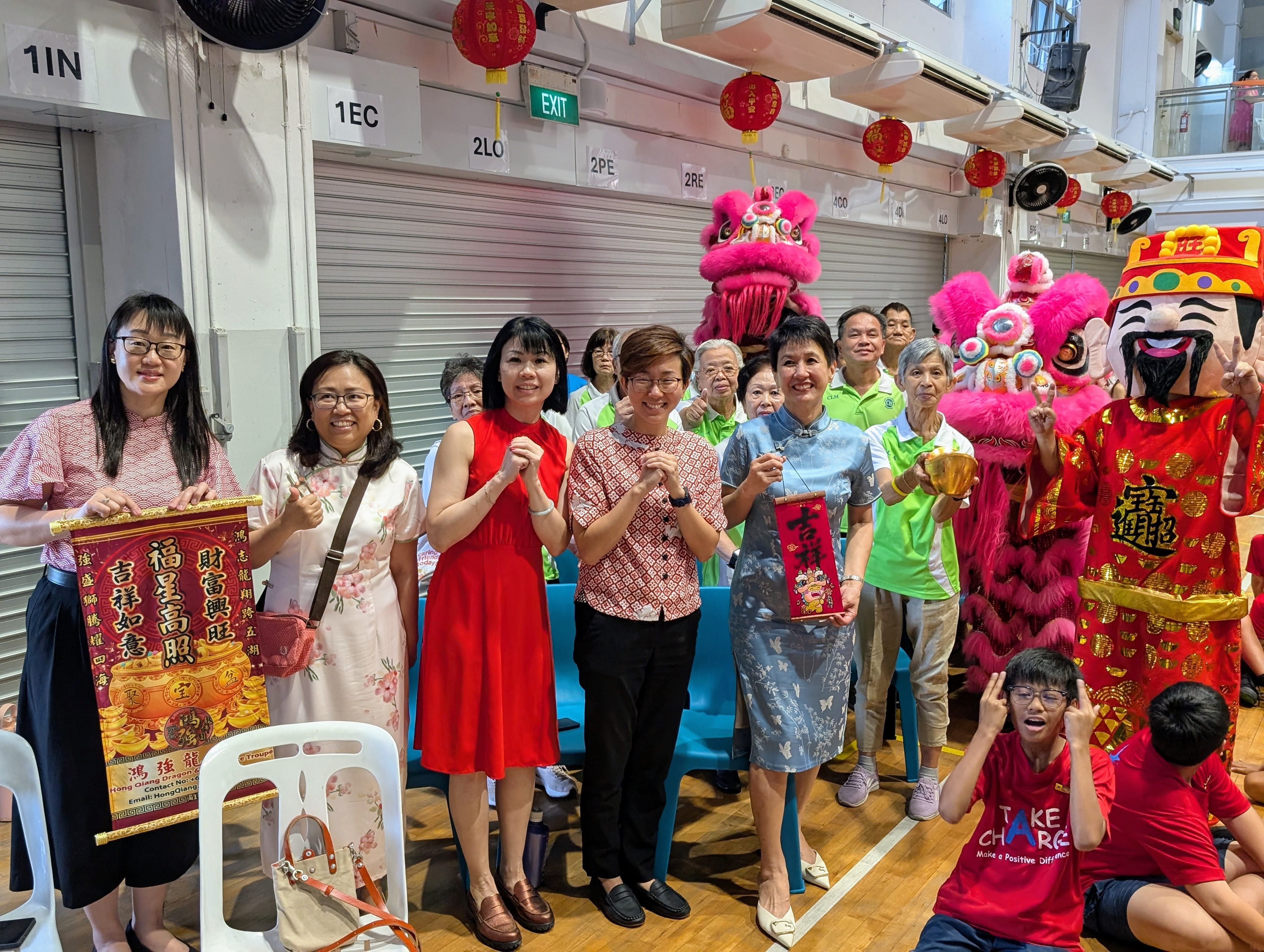 Our school leaders and elderly guests from the Lion Befrienders pose for a group photo with good wishes