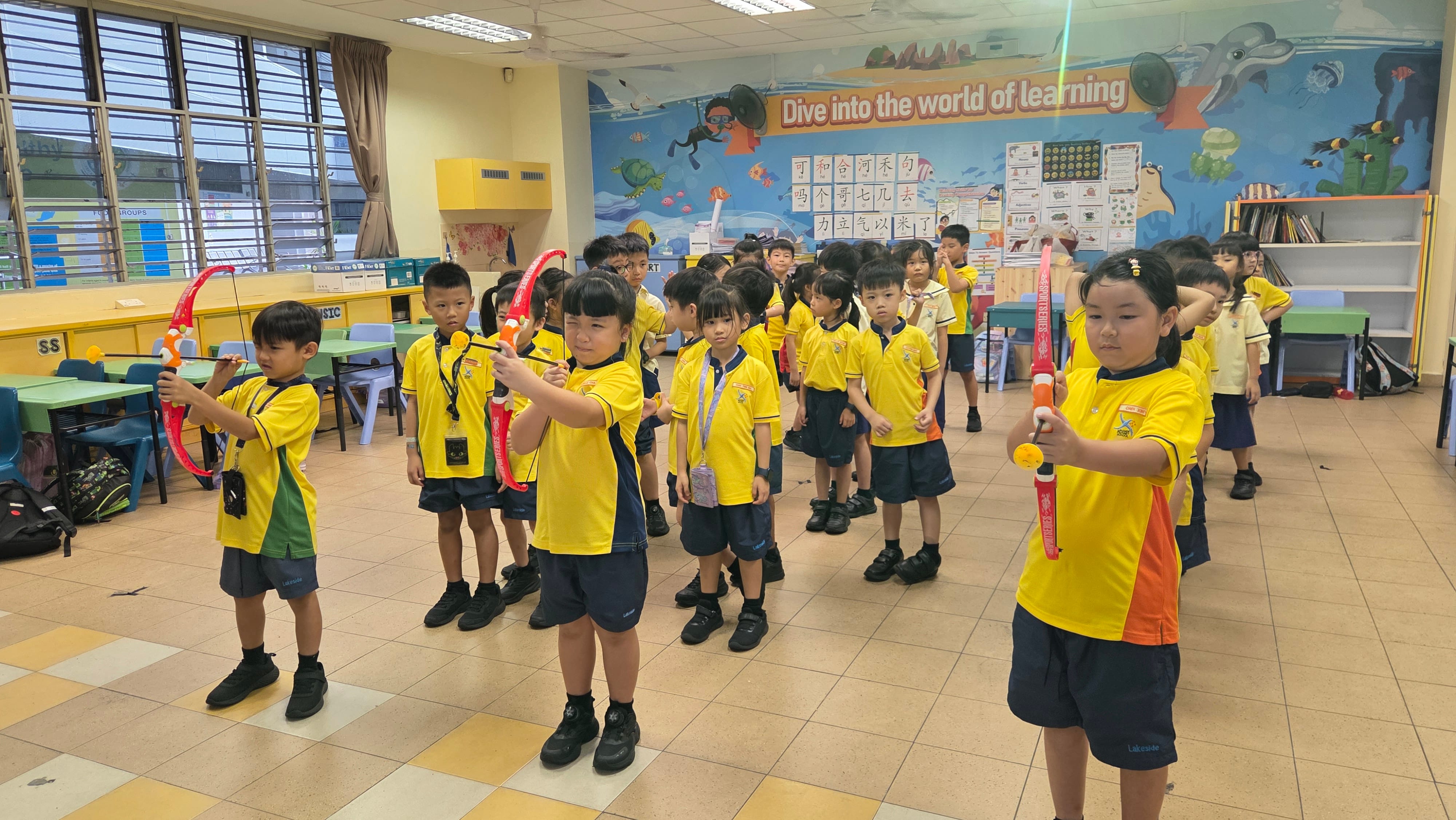 P1 students queue up for their turn to shoot in a game of archery