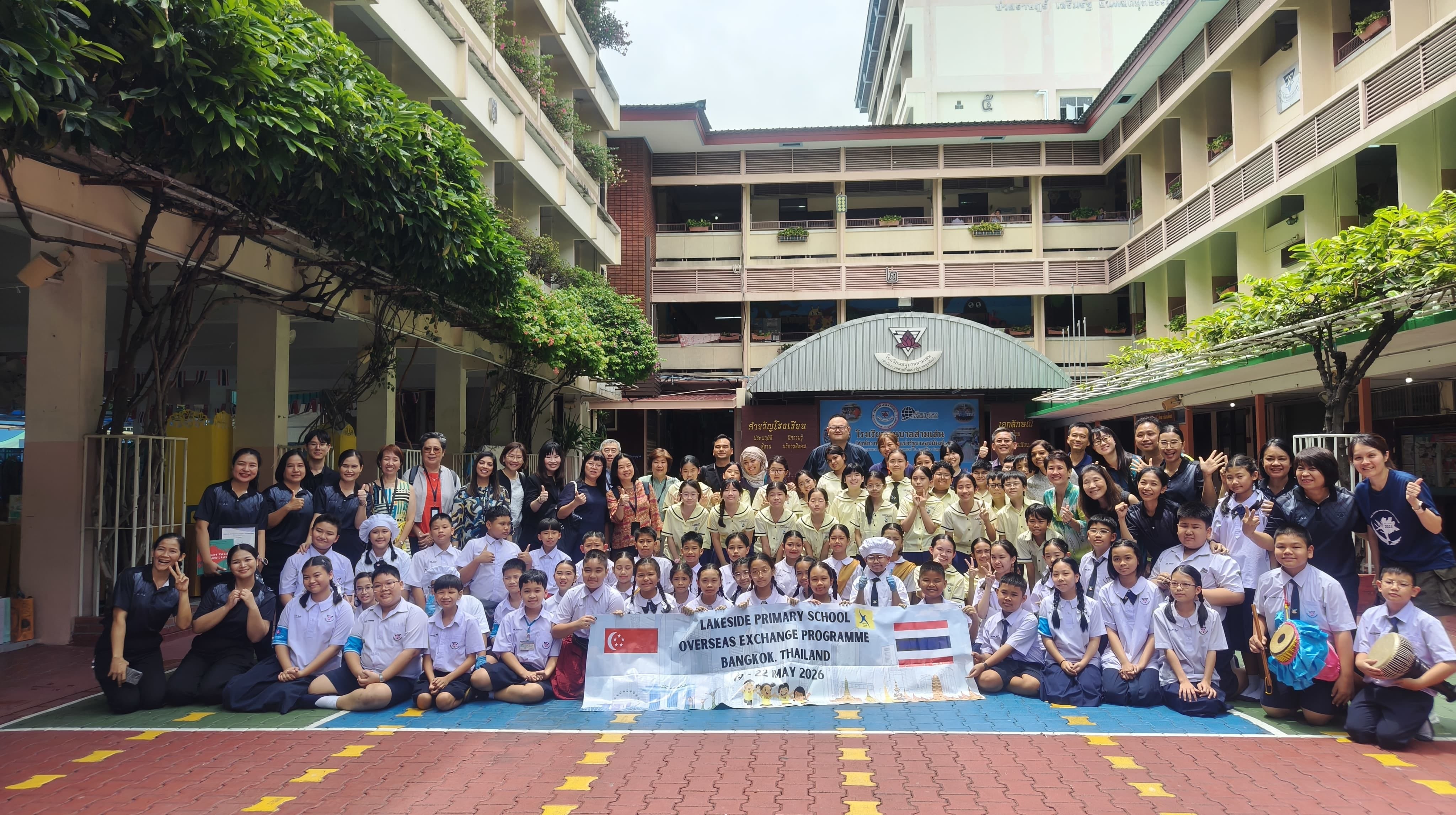 A group photo of the students, staff and teachers from both schools