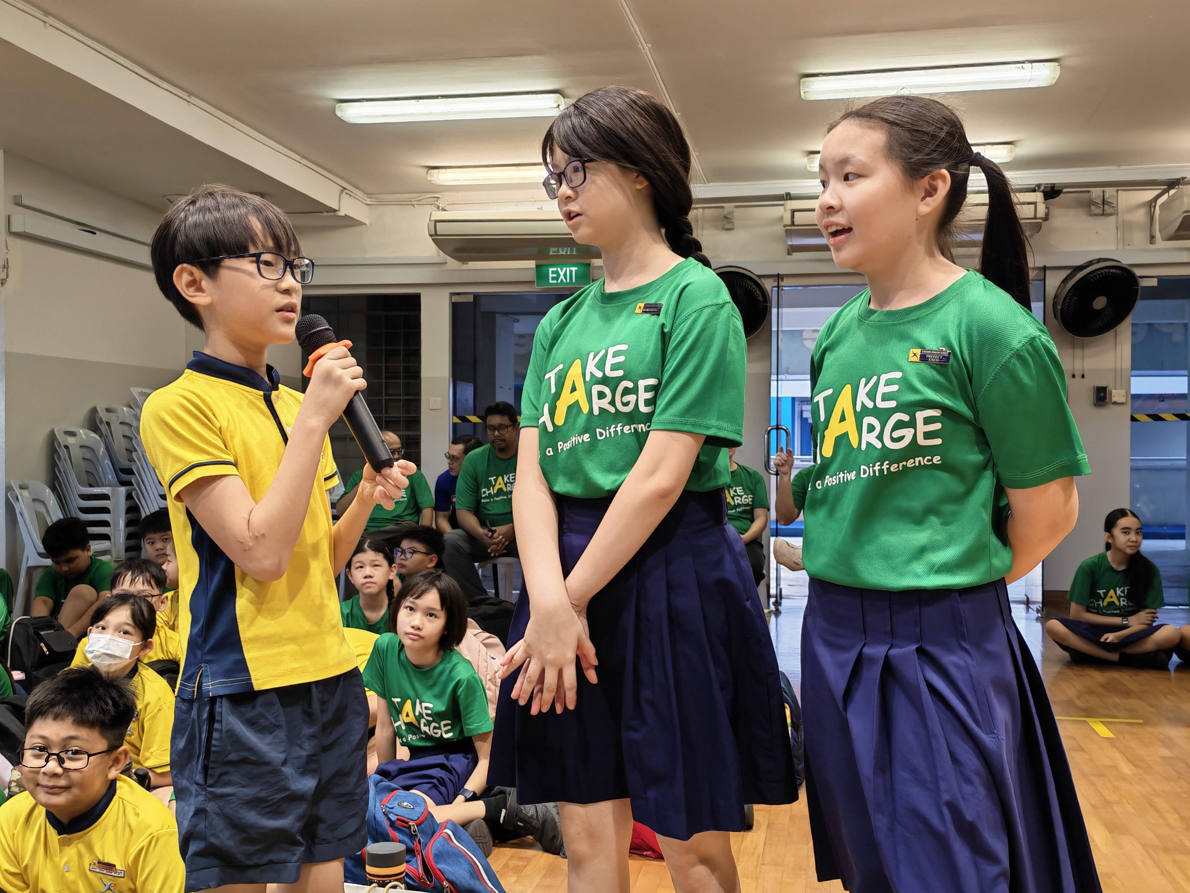 Students take part in an interactive classroom discussion during Racial Harmony Day, sharing their thoughts and listening respectfully to one another.
