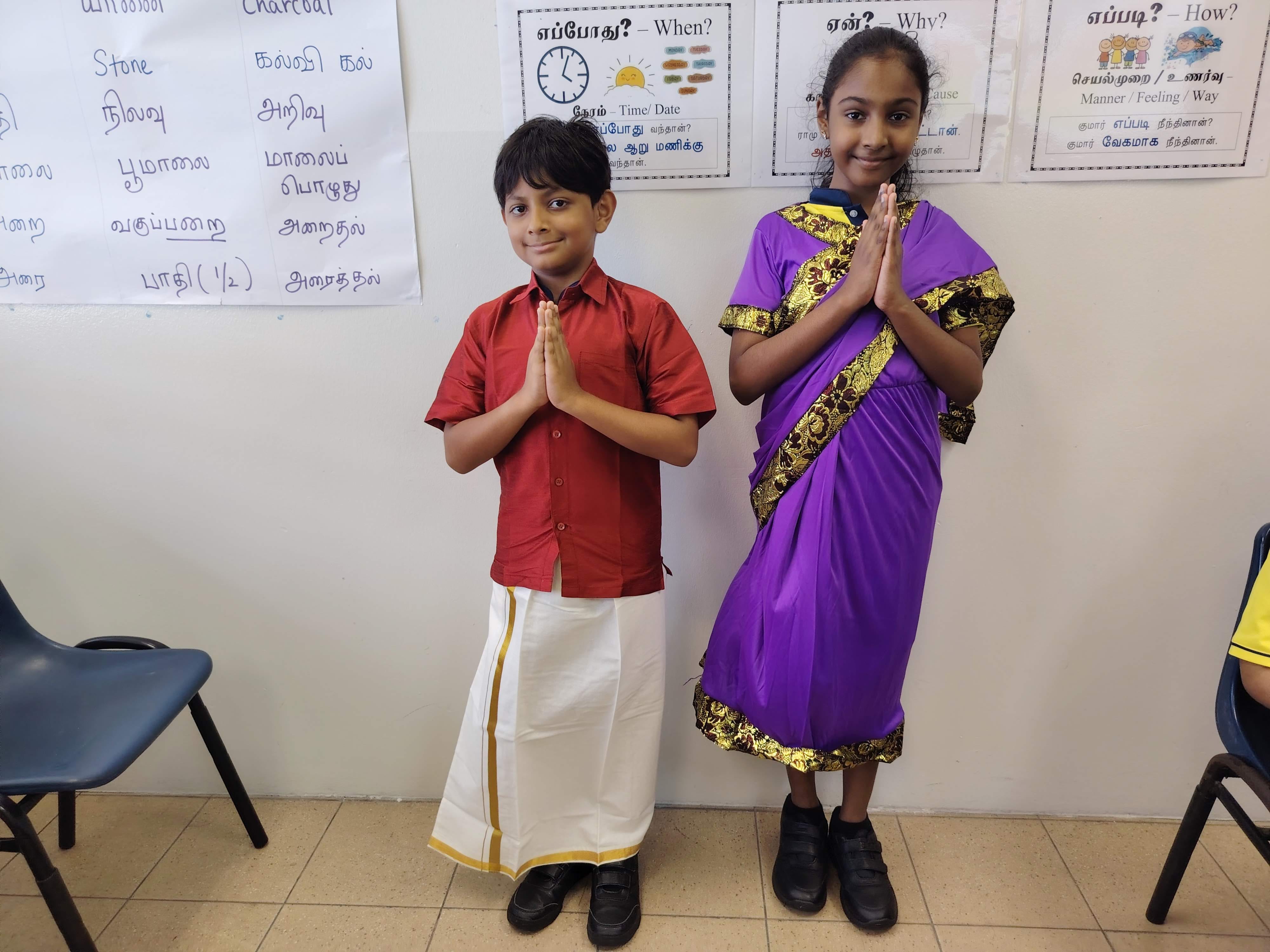 Two P4 students posed together while dressed in traditional Indian costumes