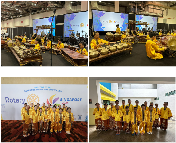 Children in yellow traditional outfits play gamelan instruments and pose at the Rotary International Convention Singapore 2024.
