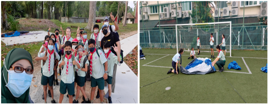 Students in scout uniforms pose for a group photo outdoors, while others set up a tent on a sports field nearby.