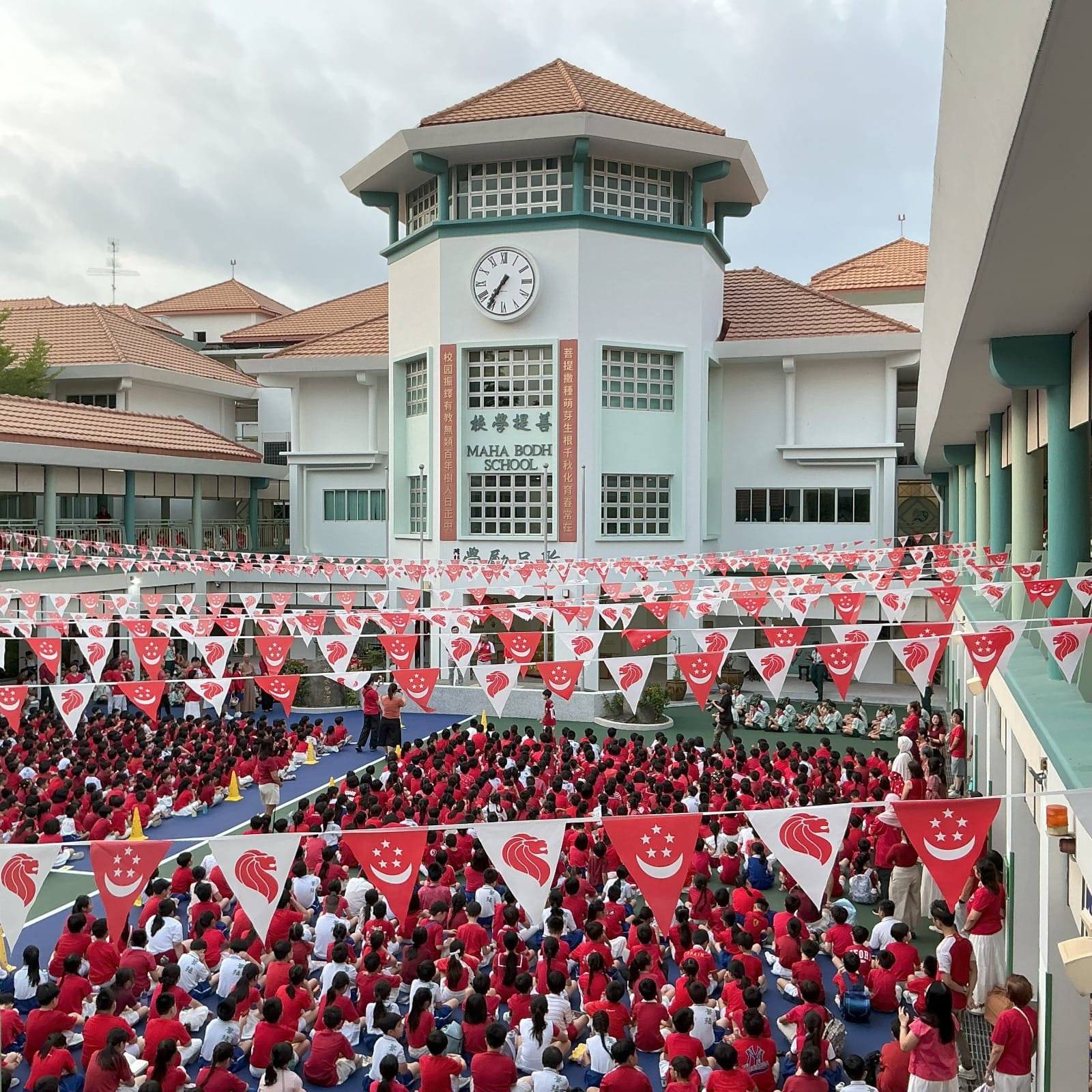 Mr Seah Kian Peng, Speaker of Parliament addressing pupils who were listening attentively in the parade square. 