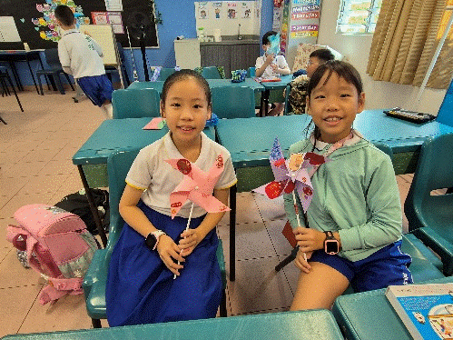 Seniors supporting their juniors to make Chinese New Year craft work.