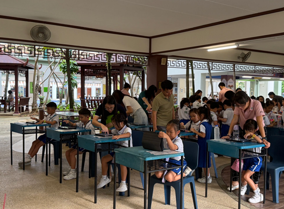 Pupils engaging attentively learning through games guided by parent volunteers during experiential week.