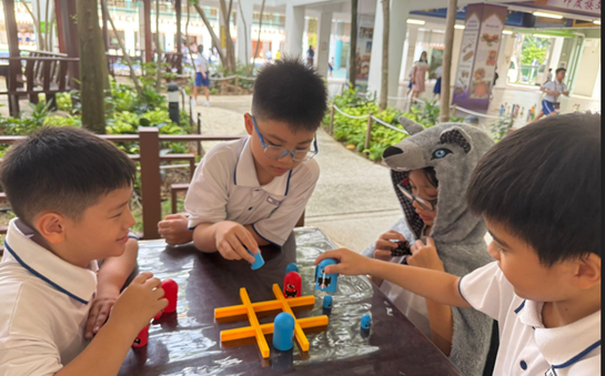 Pupils engaging attentively learning through games during experiential week.
