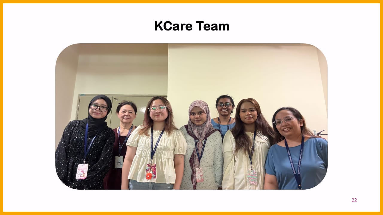 Seven women wearing lanyards pose together indoors under the heading KCare Team.
