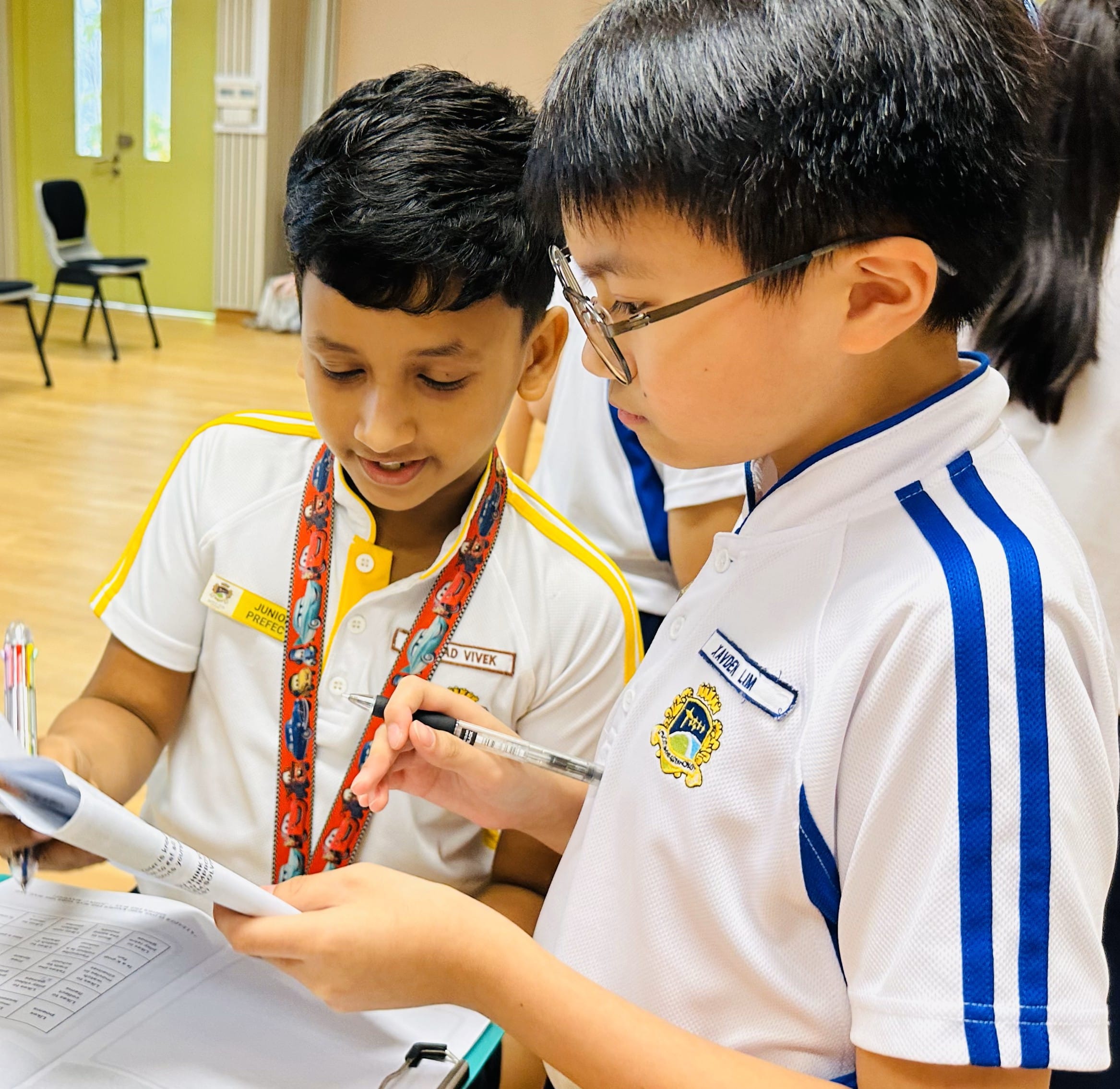A senior student sharing his experience and feedback to his junior