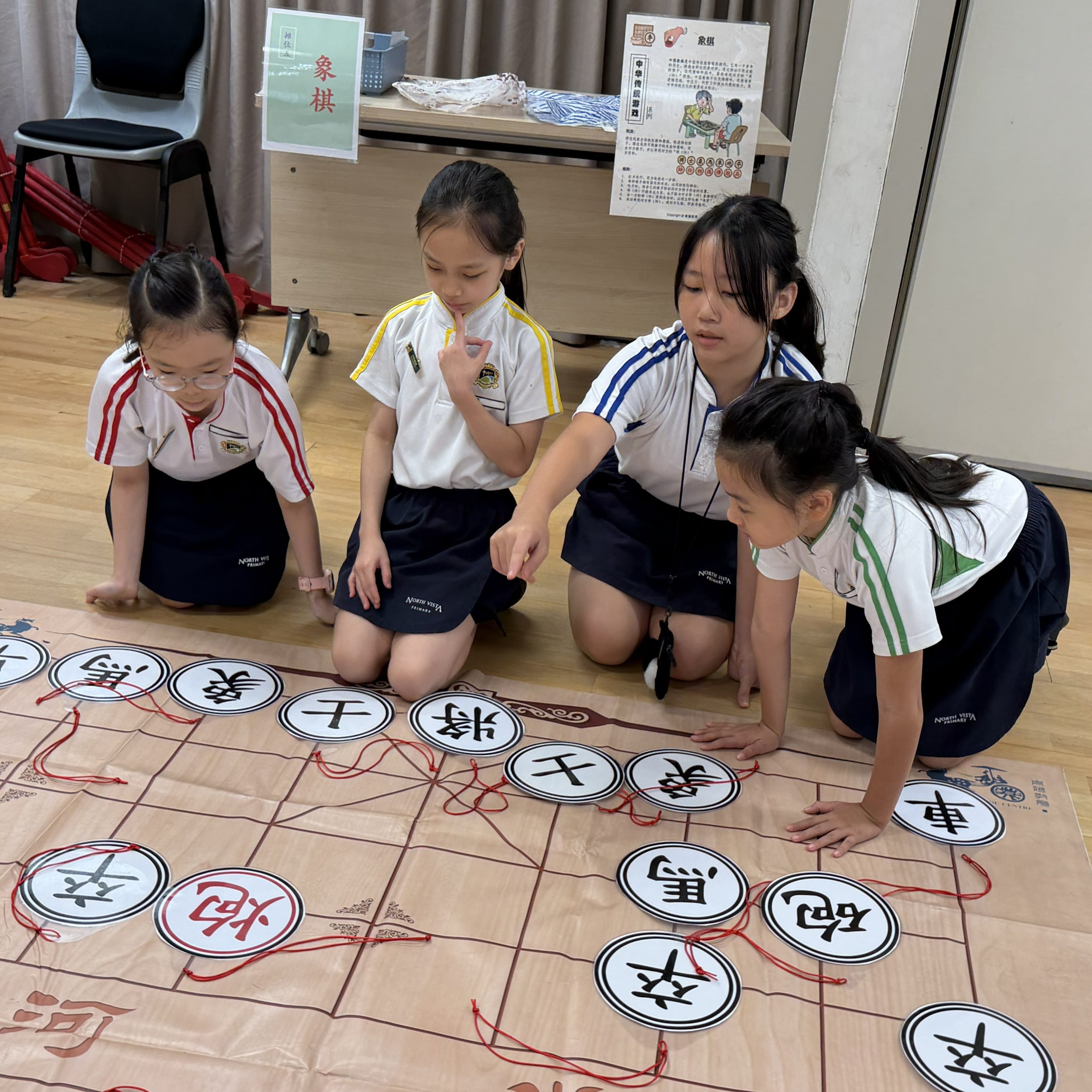 student experiencing how to play Chinese Chess