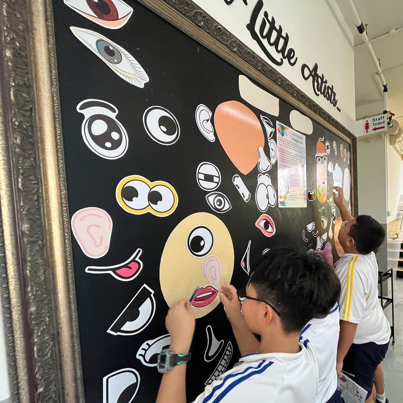 Students engaging in Art Trails using magnet pieces to express themselves