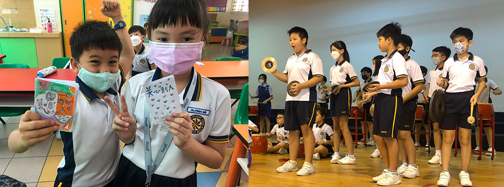 Two school children holding crafts in a classroom, beside a group of uniformed students playing percussion instruments on stage.