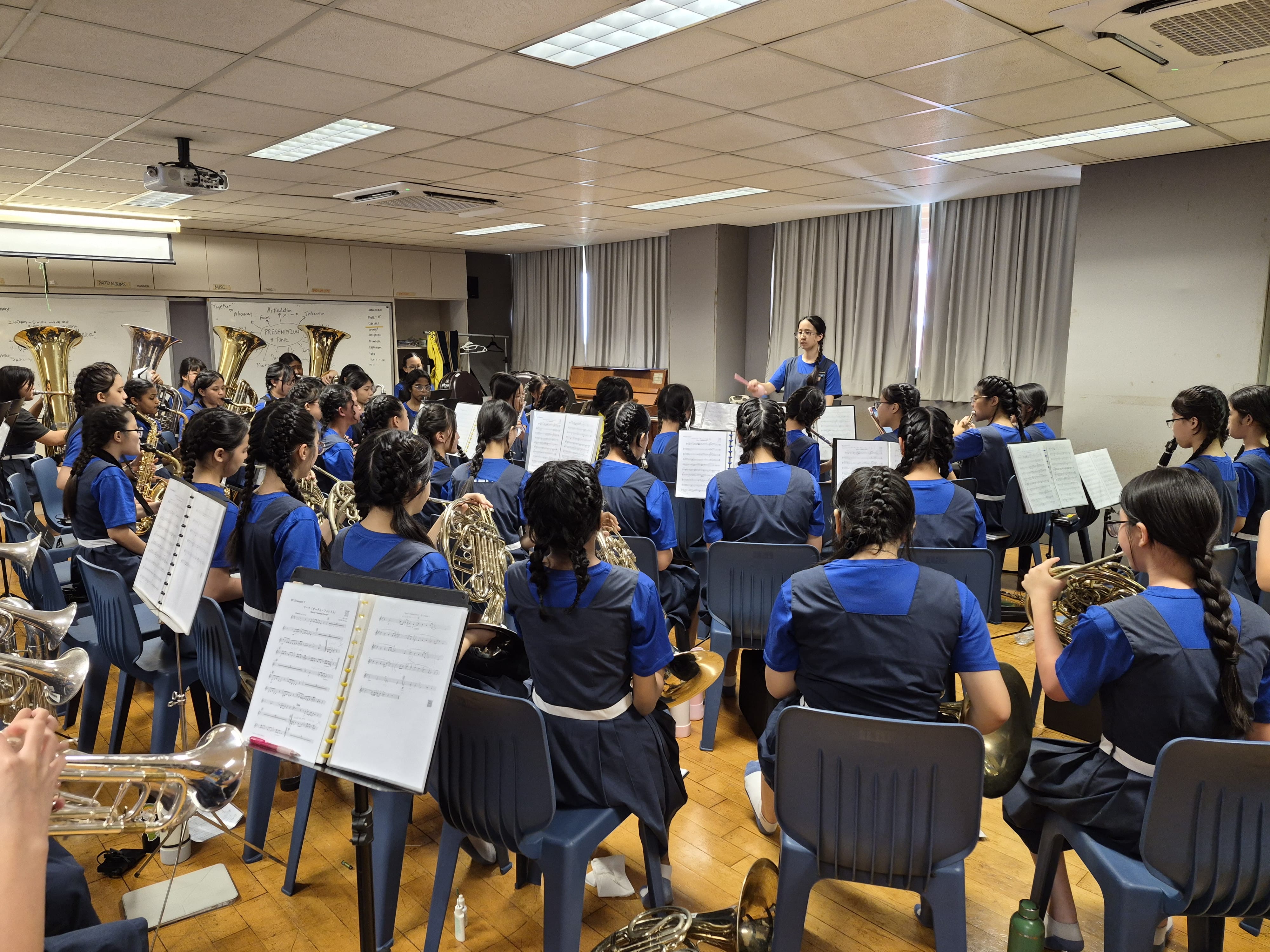 Rehearsal led by one of our student conductors, Ashlynn Kok