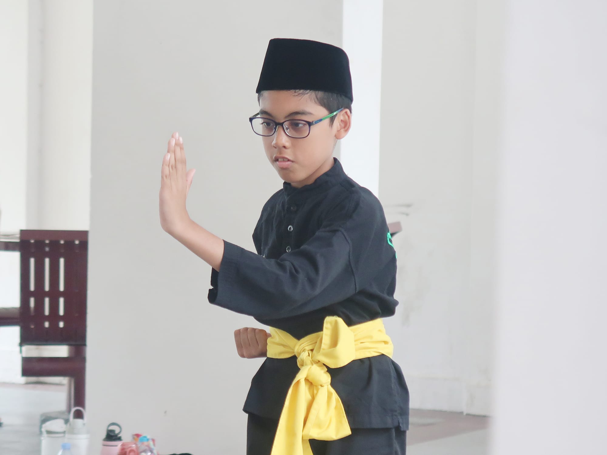 A student performs a traditional Malay silat demonstration to entertain seniors during the community engagement programme.