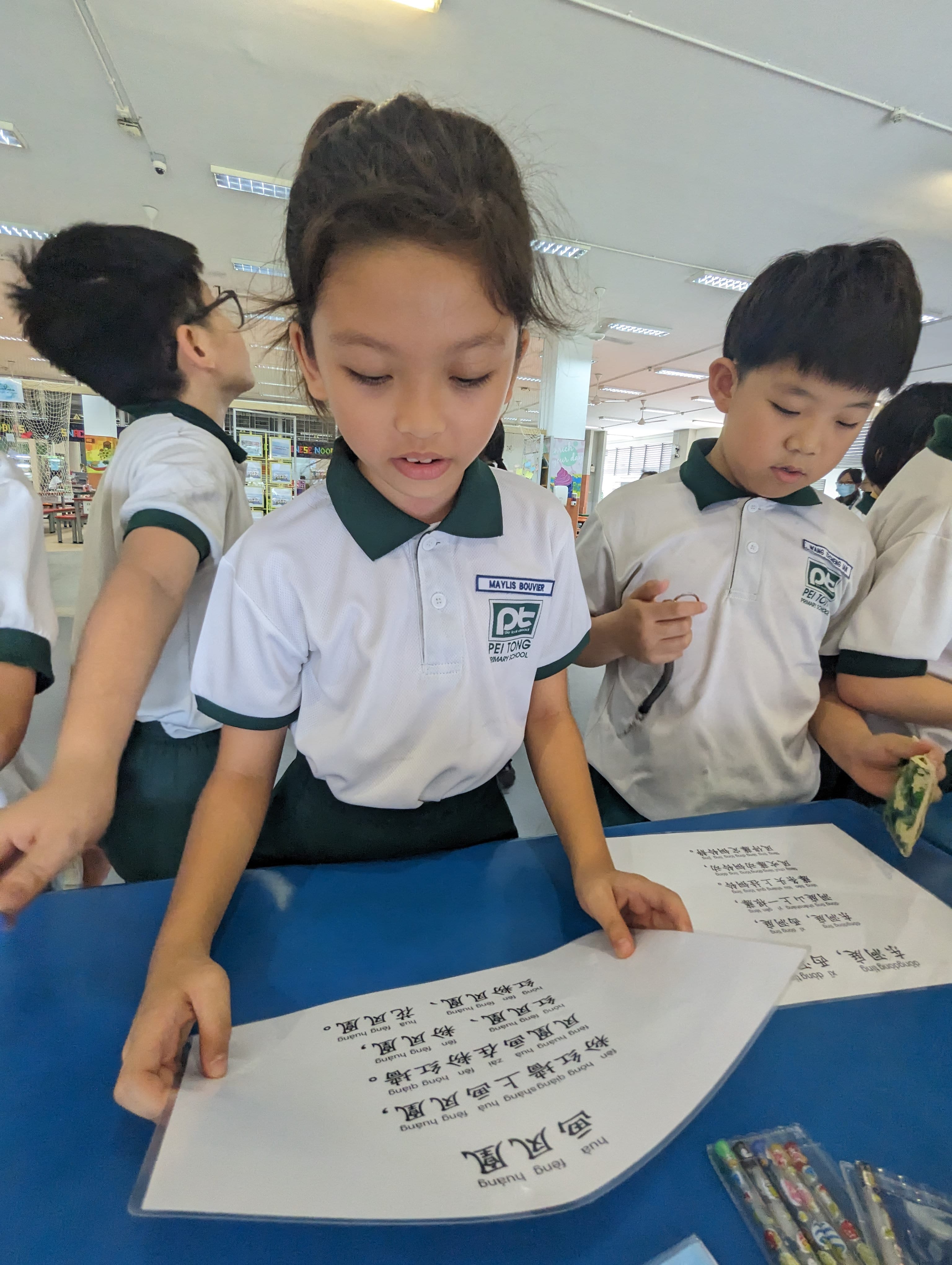 Primary 3 and Primary 4 students engaging in the 绕口令挑战 (Tongue Twisters Challenge), strengthening their pronunciation, fluency, and confidence in spoken Chinese through interactive learning.