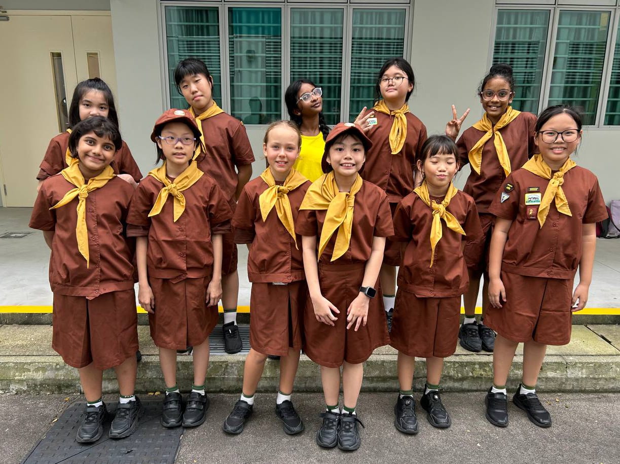 Brownies members pose together in their uniforms, showcasing friendship, confidence and a sense of belonging.