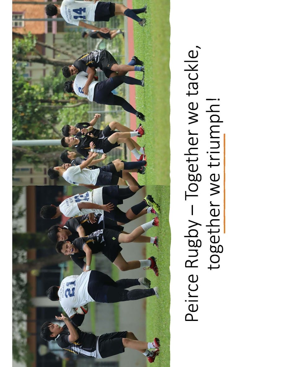 Young male rugby players in white and dark uniforms tackling and competing on a grass field.
