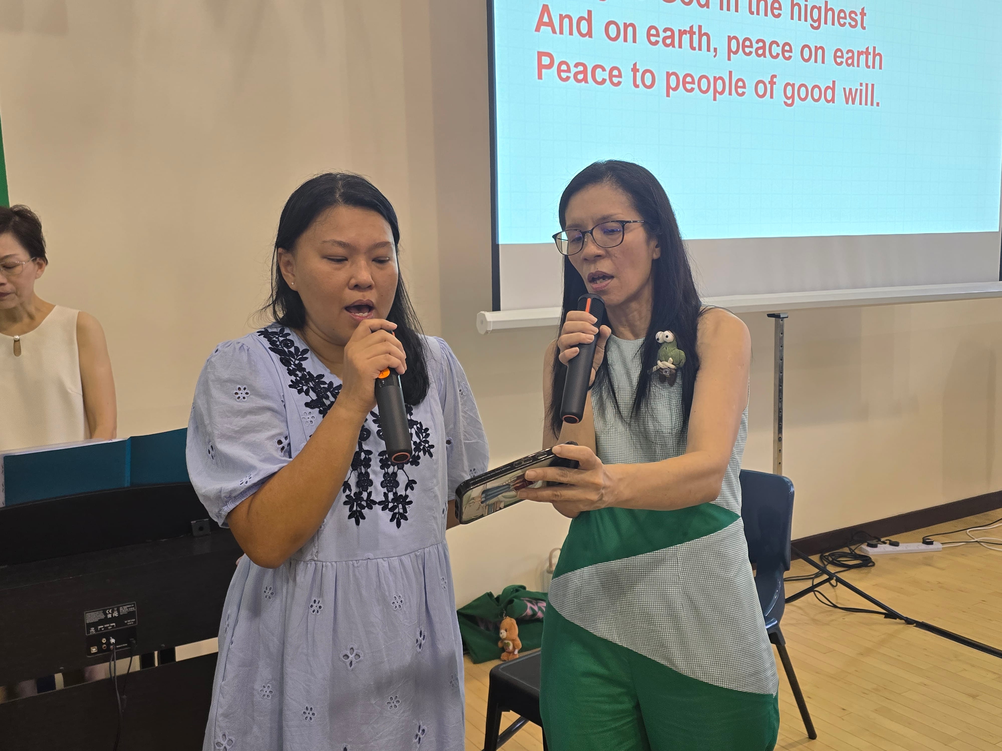 Mrs Adeline Choo and Mdm Anna Tan singing hymn