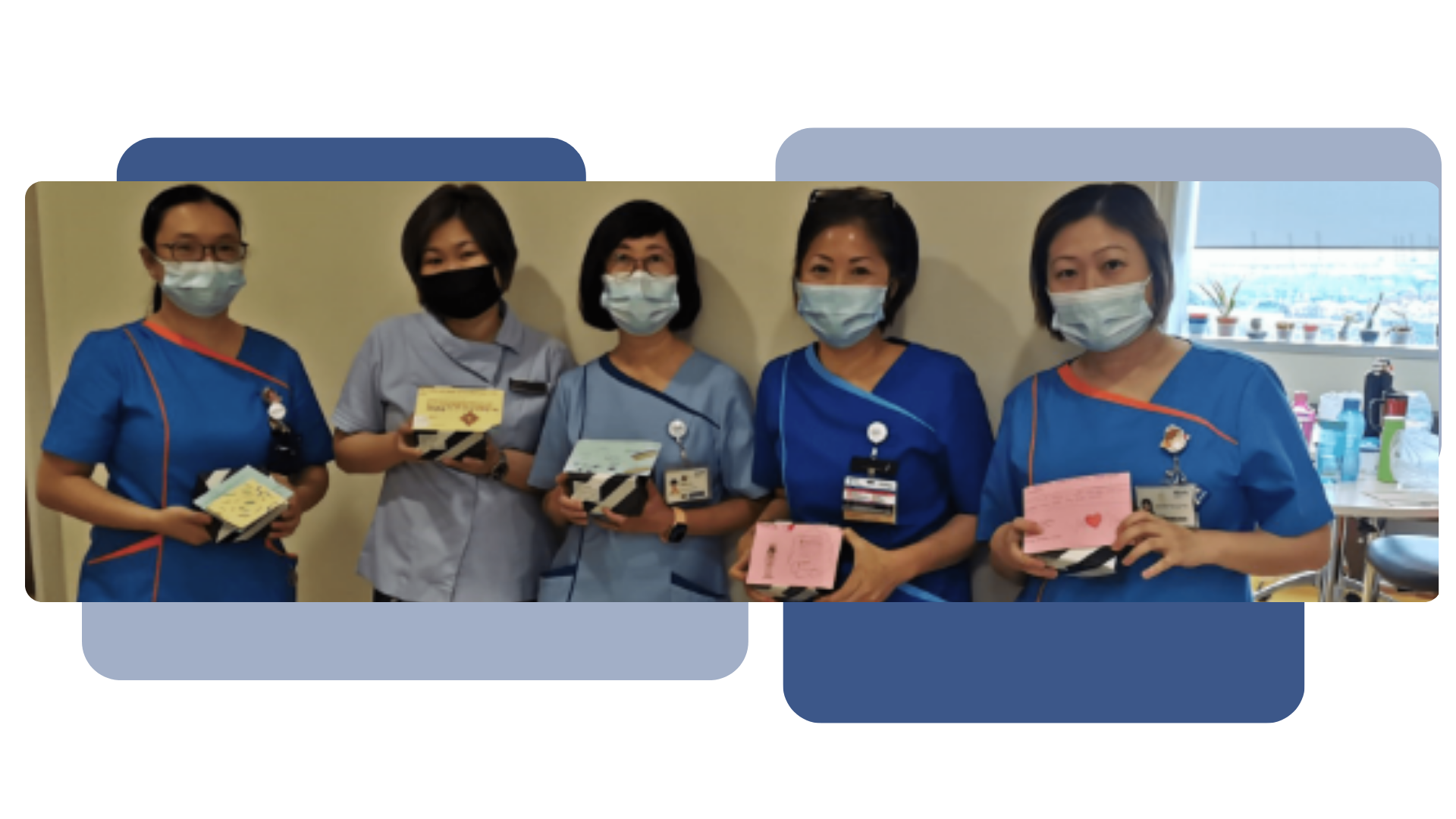Five masked nurses in blue scrubs stand together, each holding small cards or gift boxes.