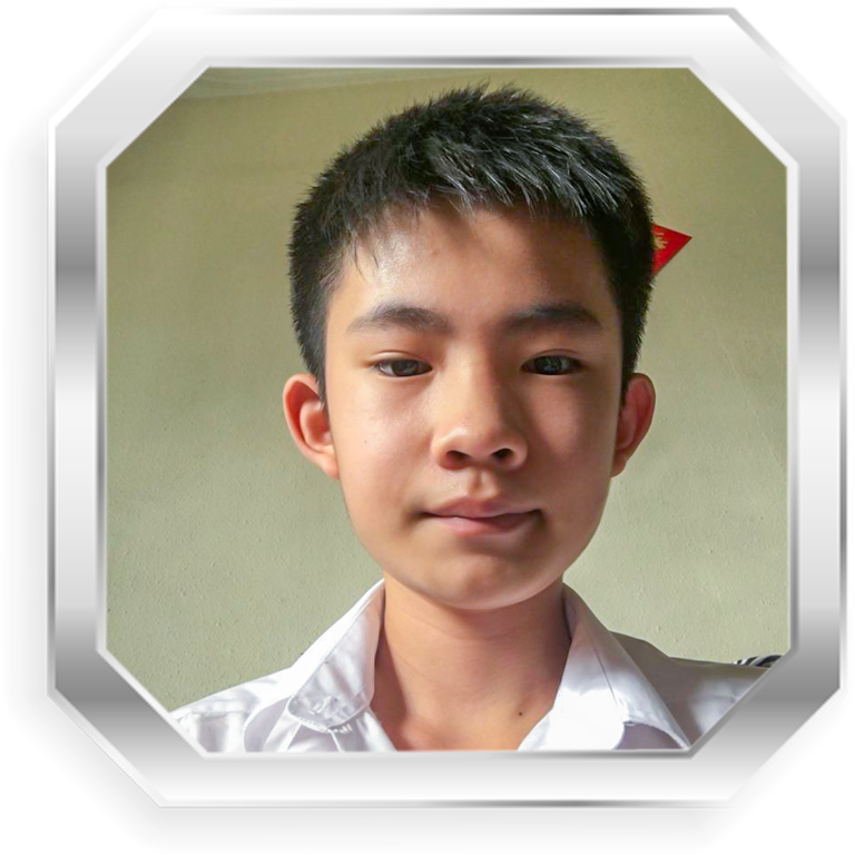Young boy with short black hair wearing a white collared shirt, framed in a silver octagonal border.