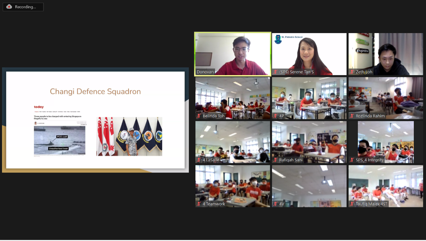 Video call with multiple classroom feeds showing students, alongside a slide titled Changi Defence Squadron.