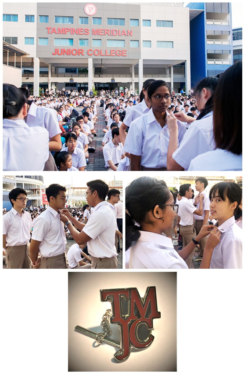 Students in white uniforms gather outside Tampines Meridian Junior College for a badge-pinning ceremony, with a TMJC pin shown below.