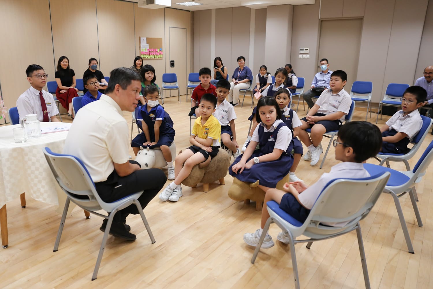 Students participating in a discussion with Minister Chan during a school engagement session.
