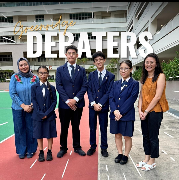 Six people pose outdoors under text reading Greenridge Debaters, with four students in navy uniforms flanked by two adults.