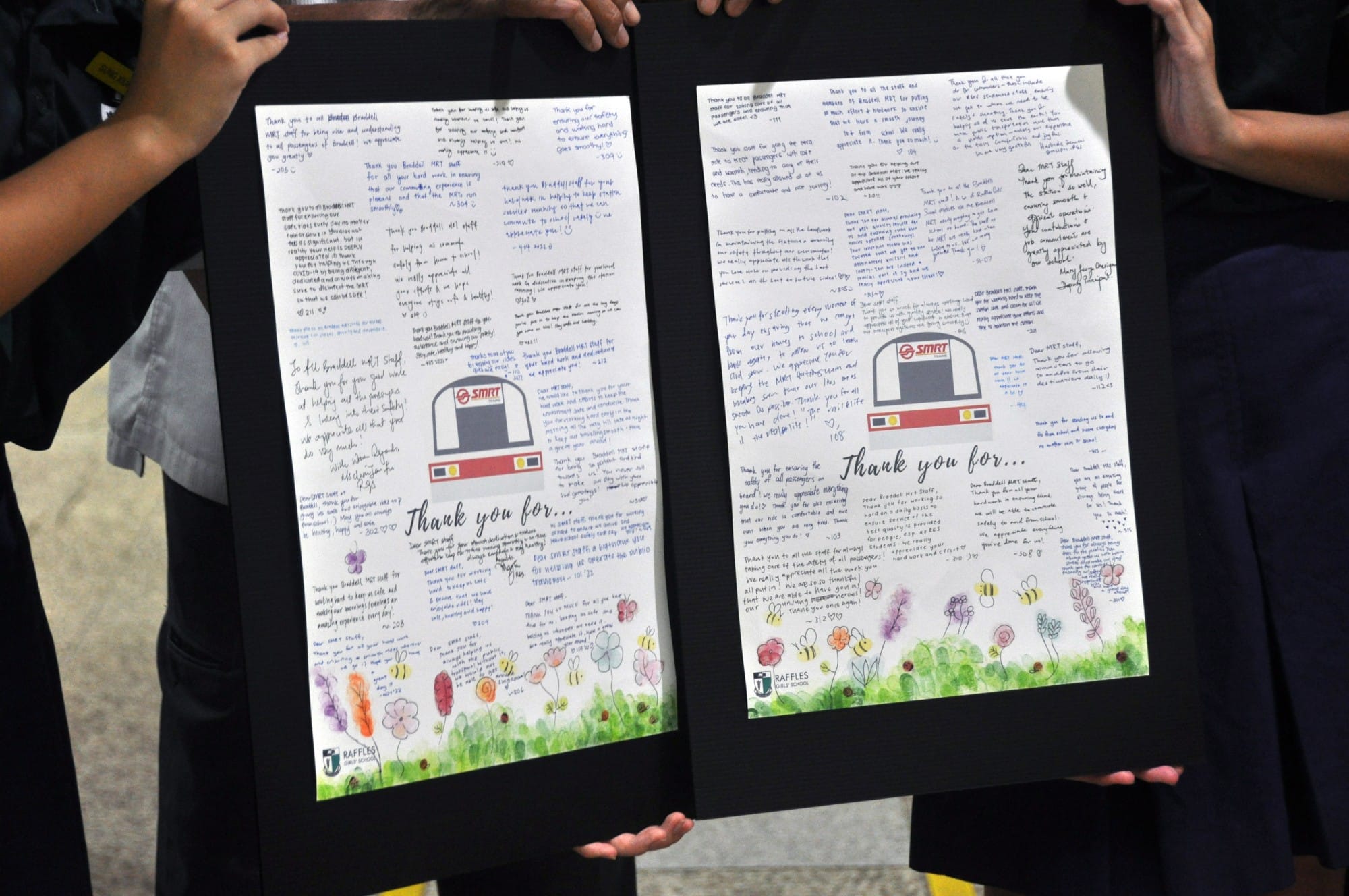 Two handwritten thank-you posters from Raffles Girls School with floral illustrations, held by students.