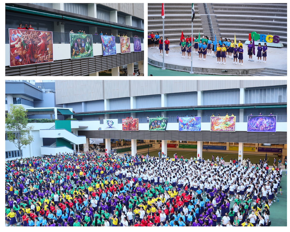 Large school gathering with hundreds of students in colorful uniforms outdoors, colorful banners displayed on building.