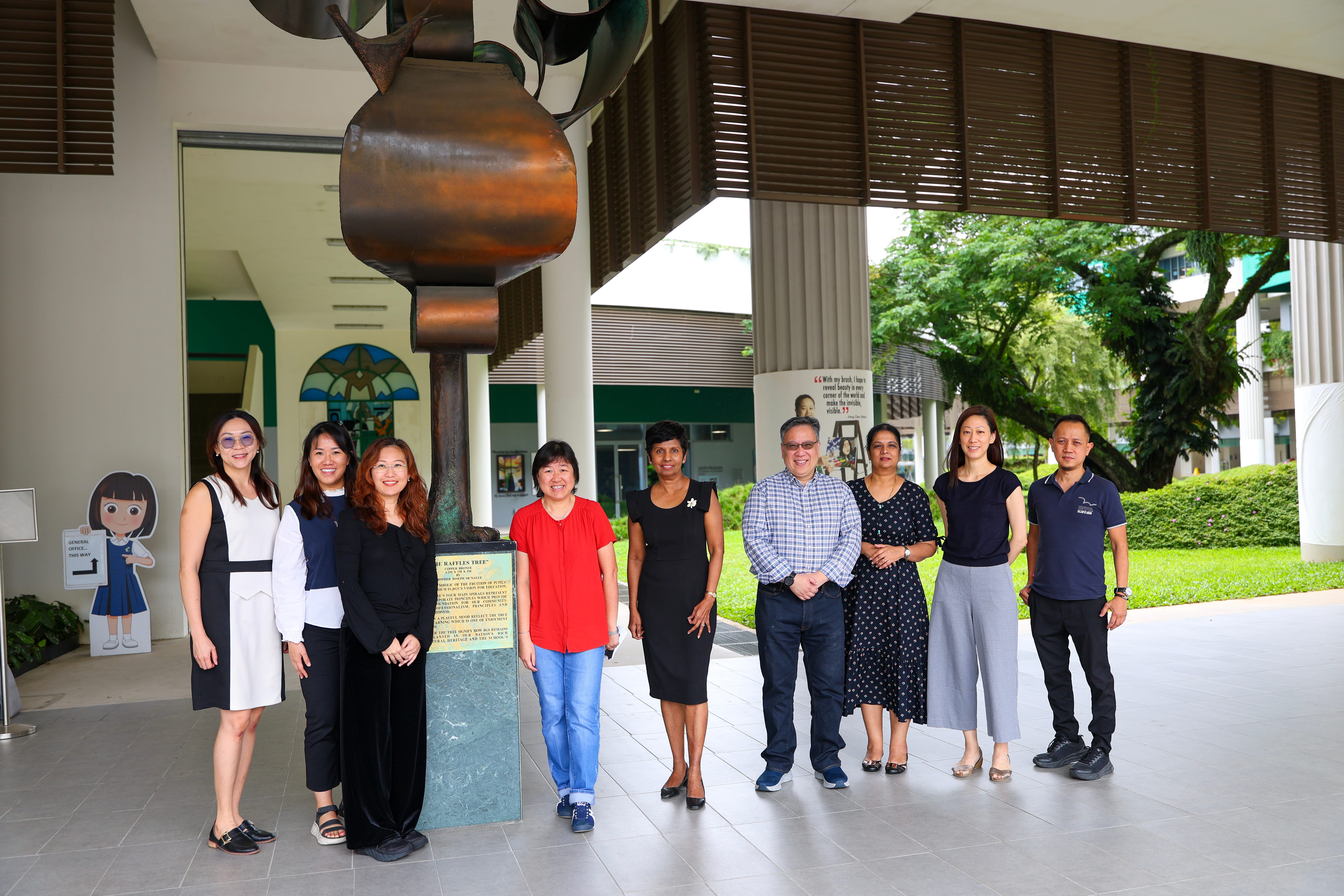 PeRL members and CRPP members stand together in front of Raffles Tree
