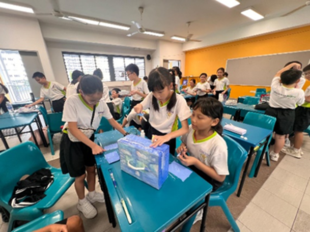 Primary 4 students collaborate to construct their Super Cooler Box prototypes