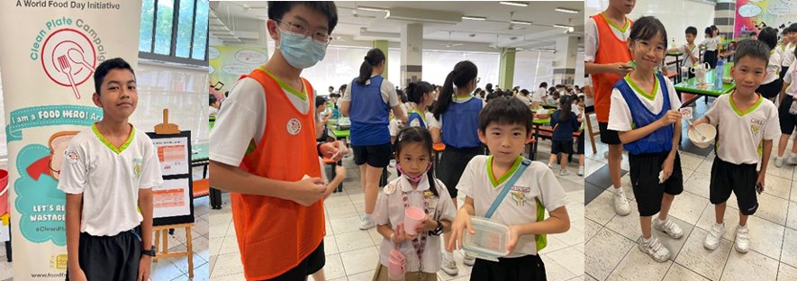 Students in school uniforms participate in a Clean Plate Campaign World Food Day event in a cafeteria.