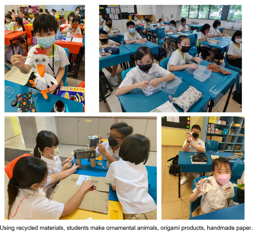 Students wearing masks work on crafts using recycled materials, making paper animals and other handmade projects in a classroom.