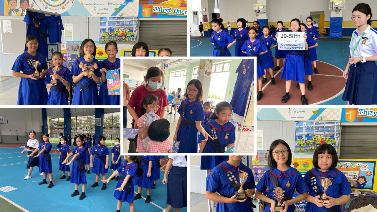 Girls in blue uniforms from Queenstown Primary School participate in a brigade event, some holding trophies.