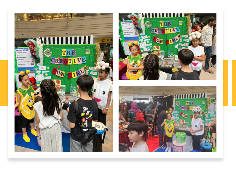 Children in costumes present a colorful science fair booth labeled "The Creative Fun Girls" to visiting kids.