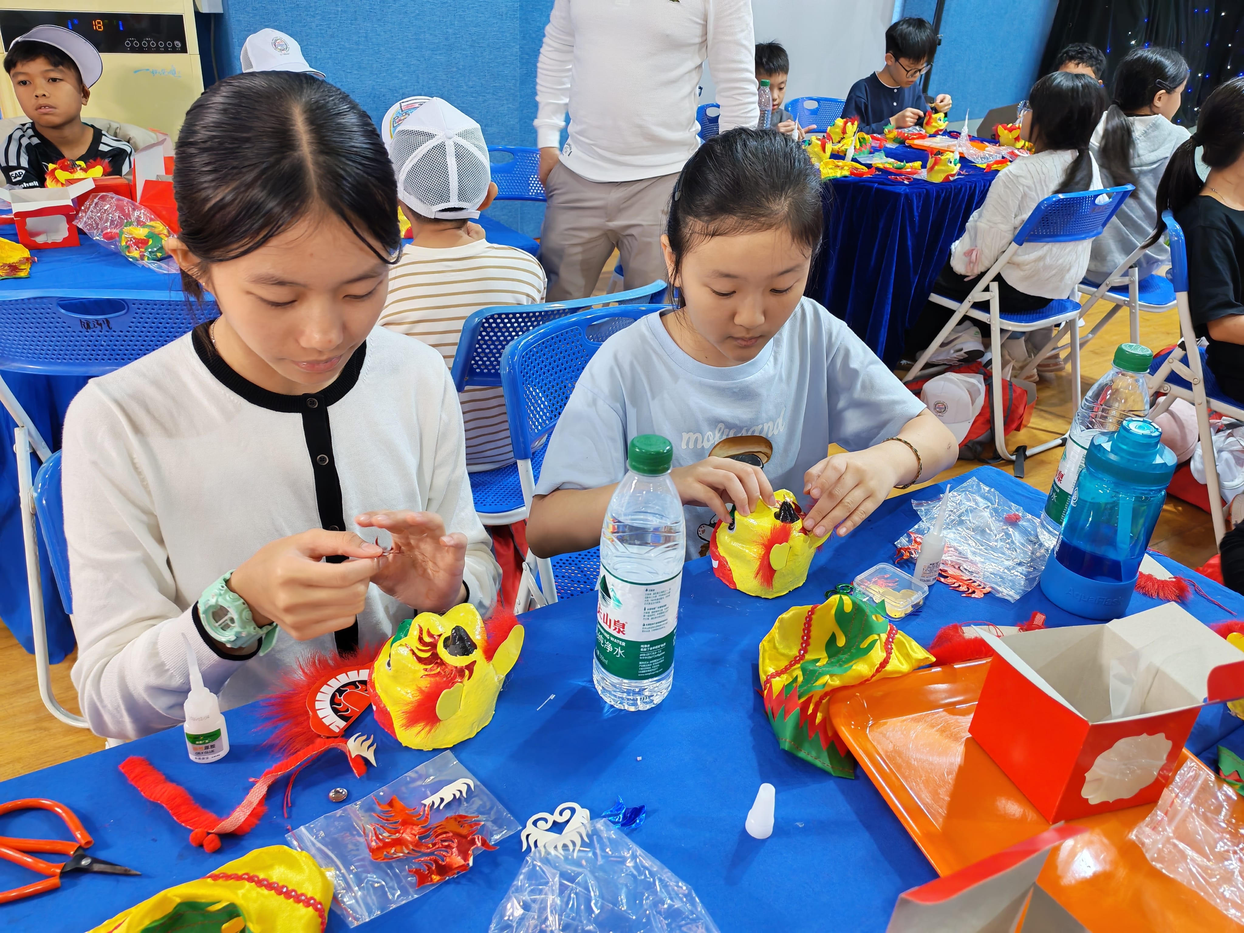 Students creating traditional crafts.