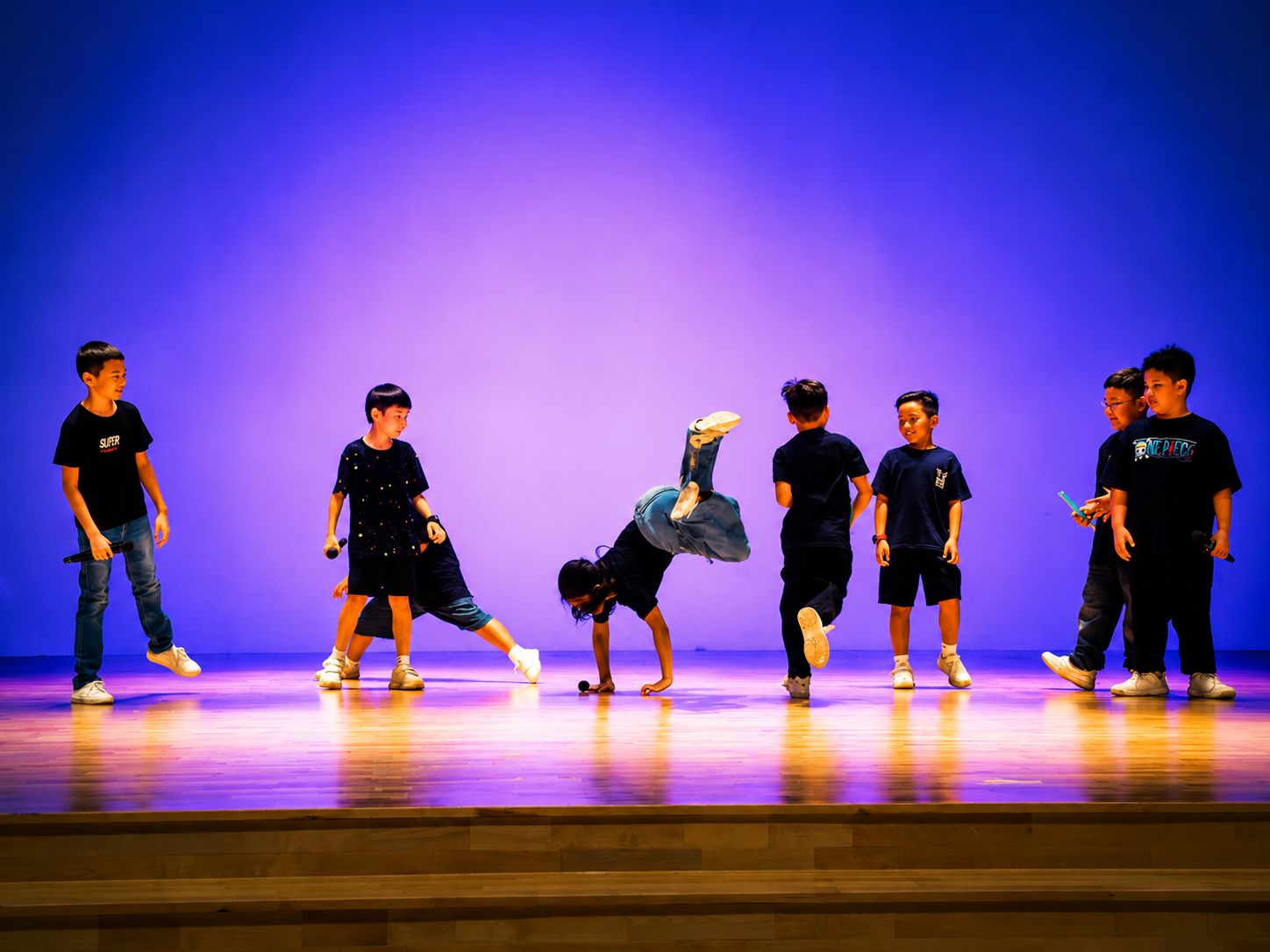 Students performing a coordinated dance routine.